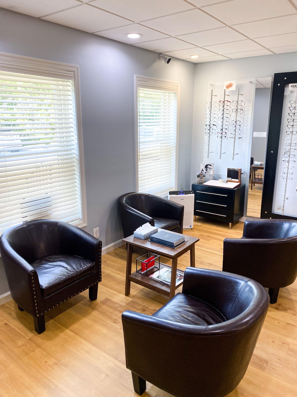 Comfortable waiting lounge with leather seating and frame displays