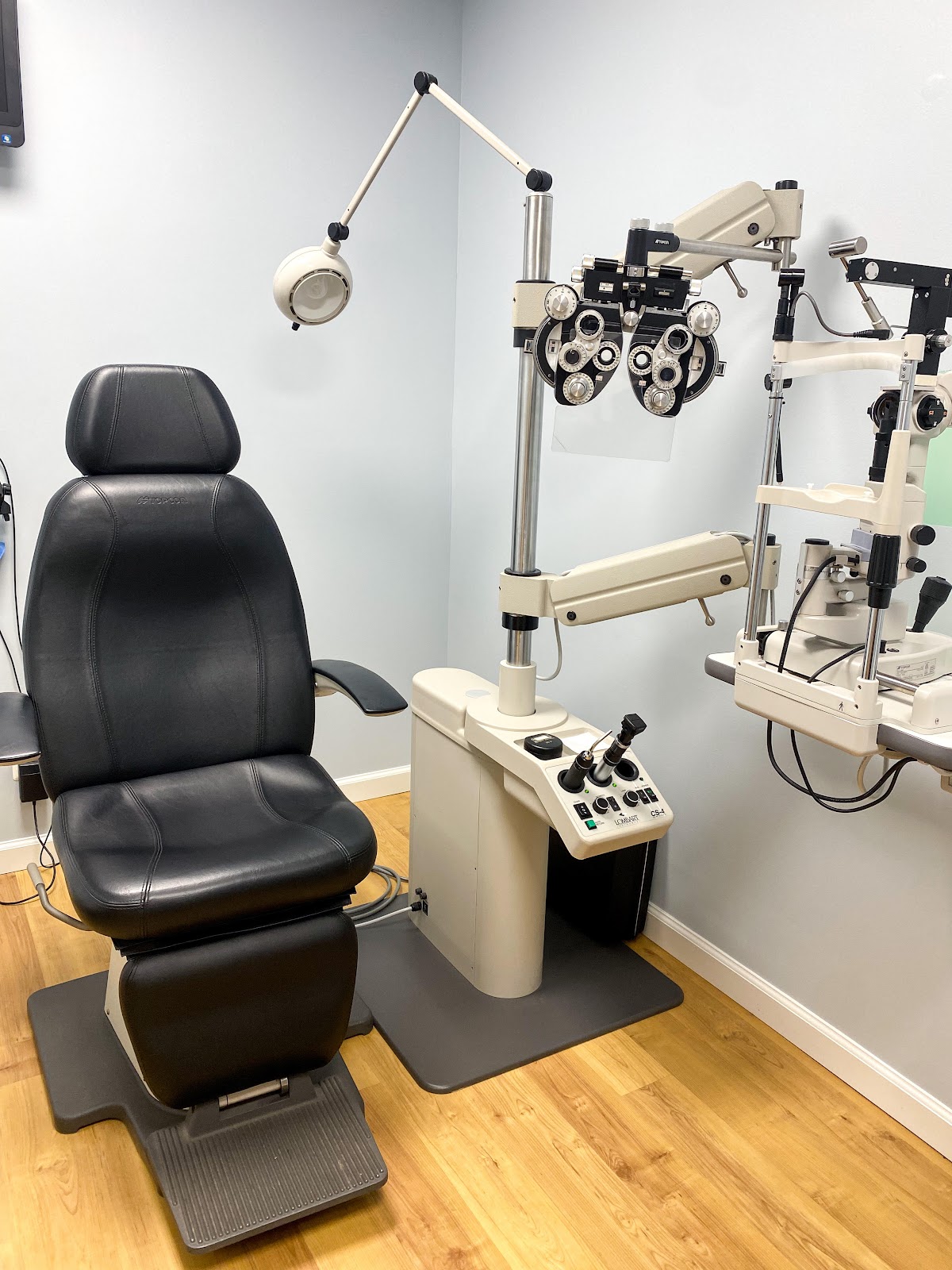 Exam lane with phoropter and patient chair
